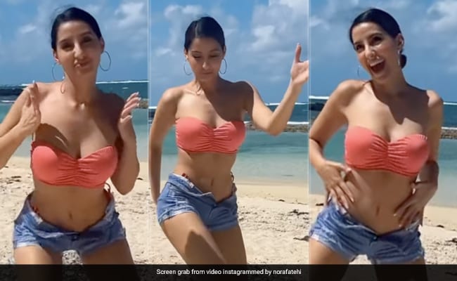 Nora Fatehi's Beach Look: Red Bikini Photos Go Viral Nora Fatehi's Beach Look: Red Bikini Photos Go Viral
